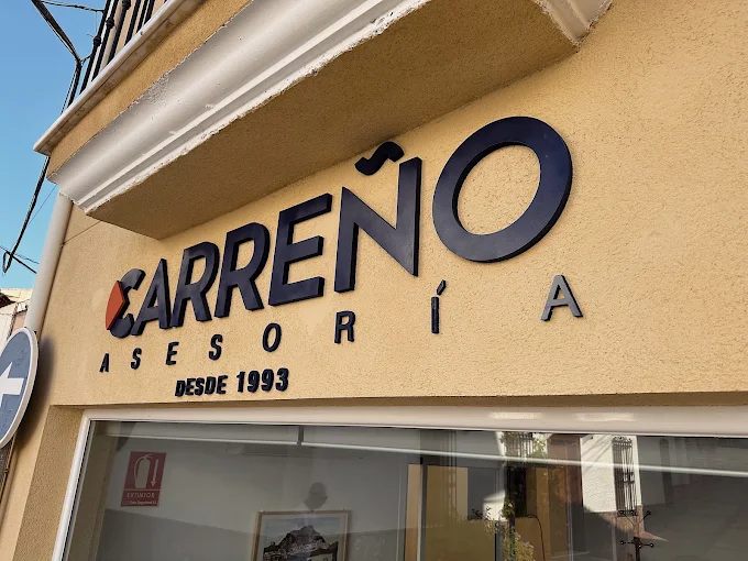 Fachada de Asesoría Carreño con el letrero en Calle Carrera, 11, Purchena